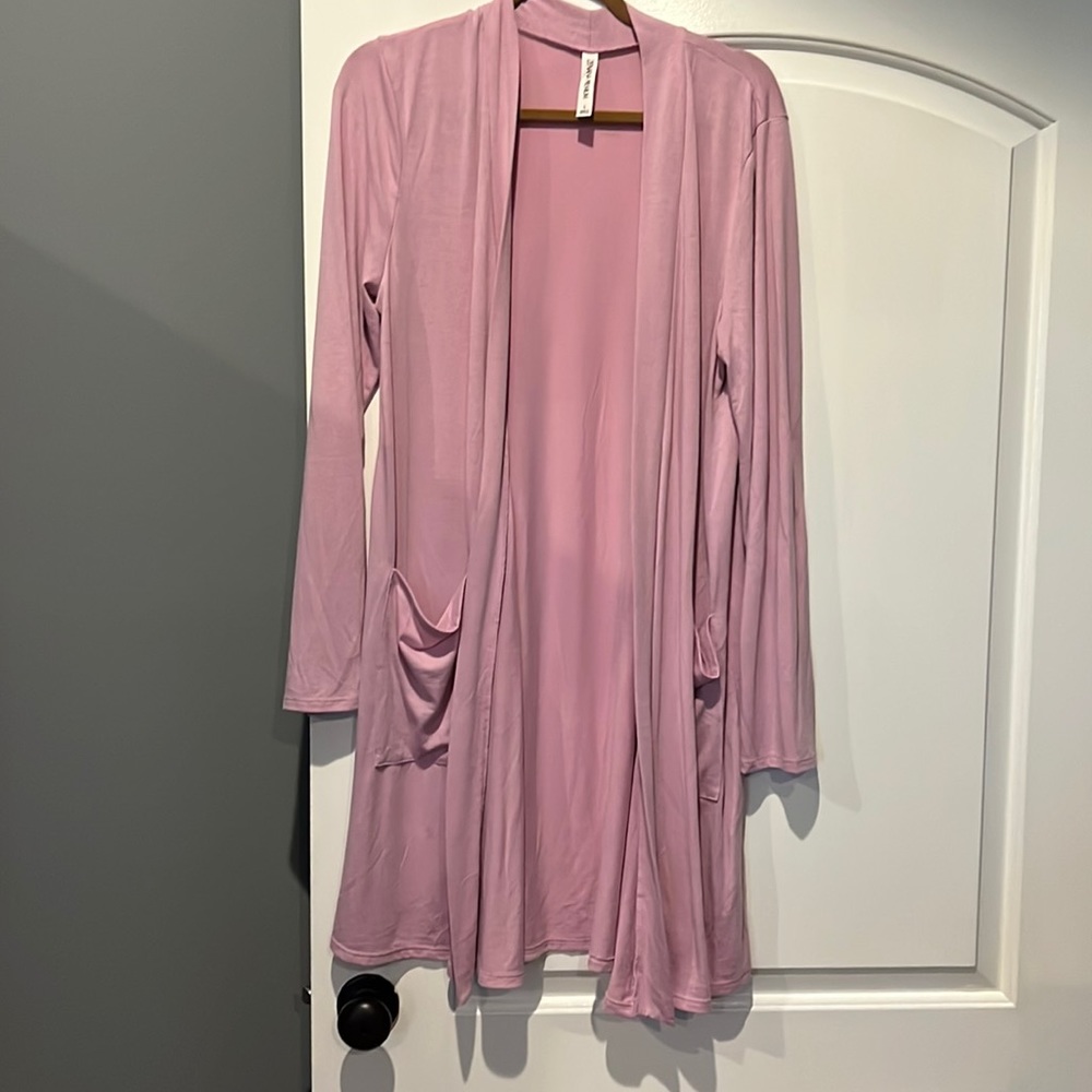 Size large, pink, pocketed cardigan and polyester, rayon and spandex